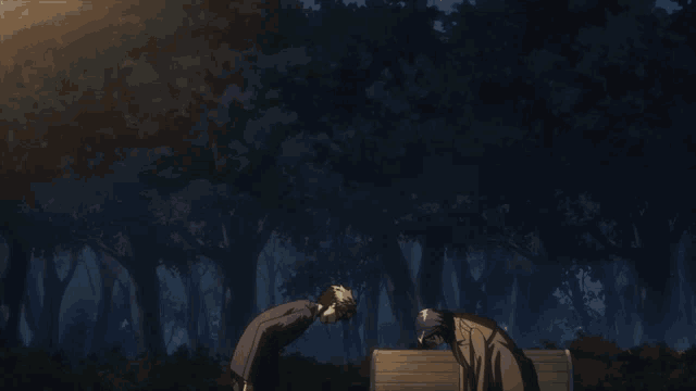 a man and a woman are bowing to each other in the dark