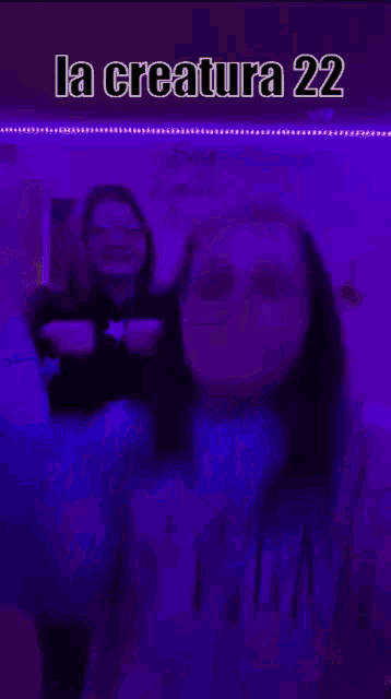 a girl is standing in front of a purple background with the words la creature 22 on it