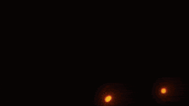 a close up of a person 's face with flames coming out of it 's mouth