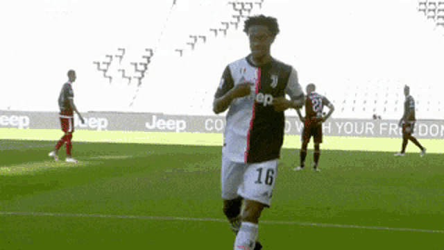a soccer player with the number 16 on his shorts is running on the field