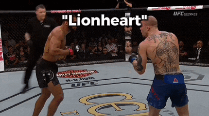two men in a boxing ring with the words " lionheart " on the top