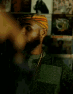 a man with a beard wearing a colorful hat