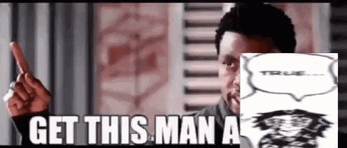 a man is pointing at a picture of a man with the words `` get this man a '' .