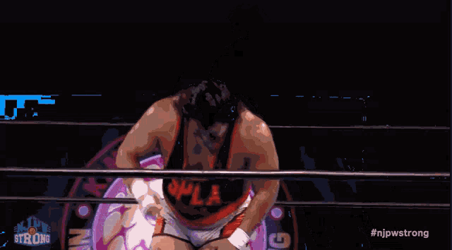 a man in a wrestling ring with the hashtag #njpwstrong on the bottom right