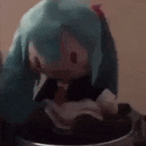 a doll with blue hair is sitting in a trash can eating something .