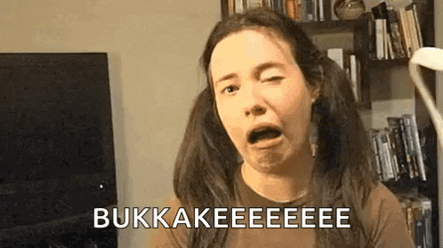 a woman with pigtails is making a funny face and saying bukkakeeeeee .
