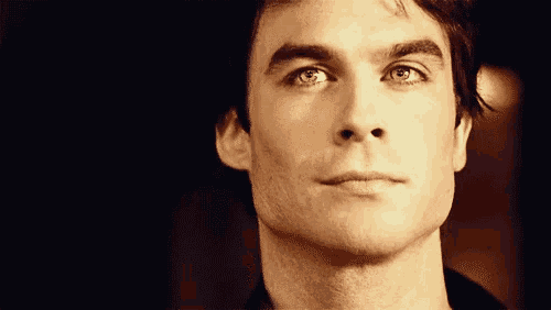 a close up of a man 's face with a serious look on his face