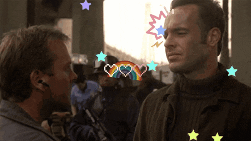 two men are standing next to each other with a rainbow and hearts on their faces