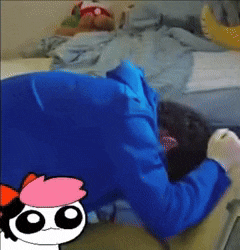 a person laying on a bed with a cartoon character with pink hair