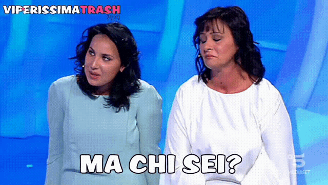two women standing next to each other with the words ma chi sei in black
