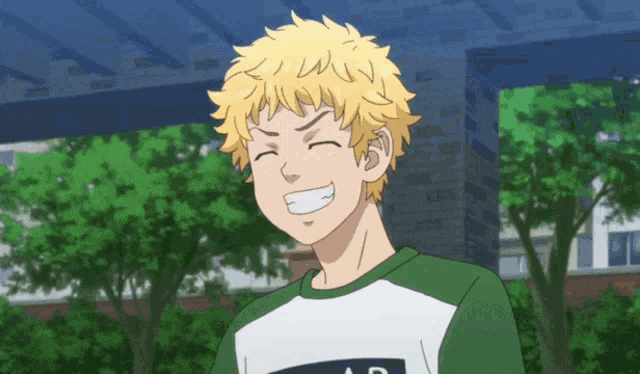 a young man with yellow hair is smiling and wearing a green and white shirt that says ad