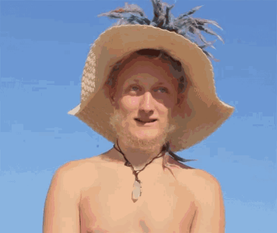 a man with a beard wearing a straw hat and a necklace