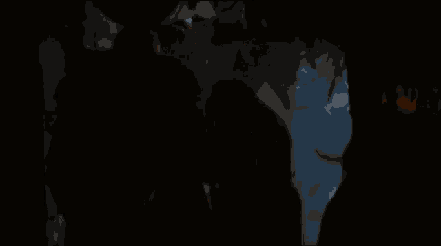 a close up of a person 's face in a dark room with smoke coming out of it .