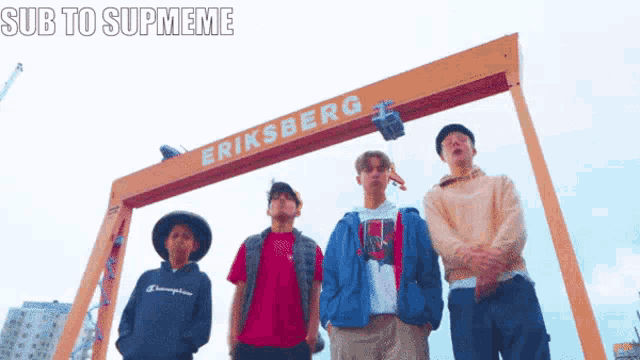 a group of young men are standing in front of eriksberg