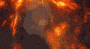 a close up of a fire with a lot of flames coming out of it
