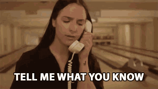 a woman is talking on a telephone with the words tell me what you know behind her