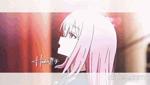 a video of a girl with pink hair and the words video.com on the bottom right