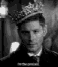 a man is wearing a crown on his head .
