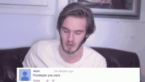 a man is sitting on a couch with a reply from alan