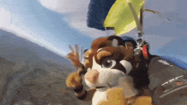 a mascot is flying through the air with a parachute attached to it