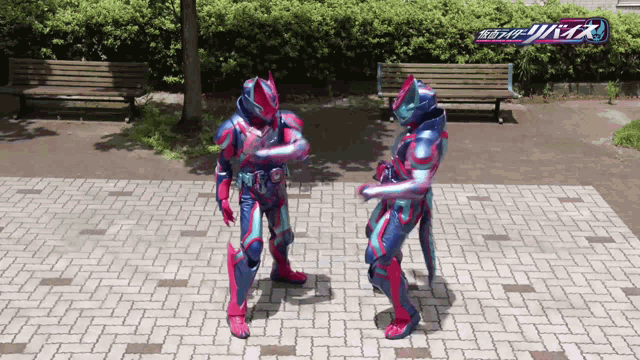 two kamen riders are standing on a brick walkway
