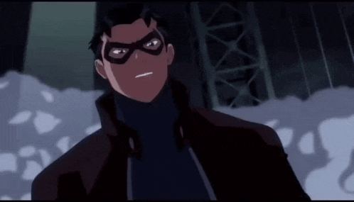 a close up of a cartoon character wearing a mask and turtleneck .