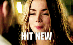 a woman with her eyes closed and the words hit new written on her face