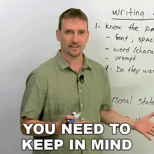 a man stands in front of a white board that says " writing "
