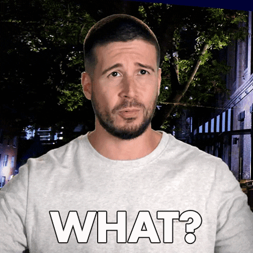 a man with a beard is wearing a white shirt that says what