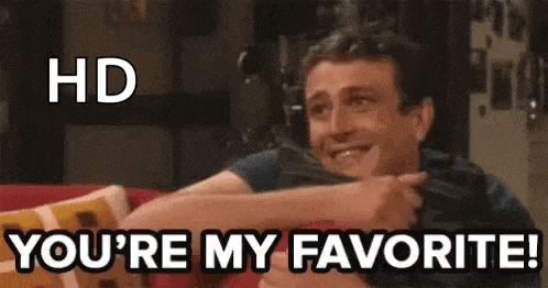 a man is sitting on a couch with his arms outstretched and says `` you 're my favorite ! ''