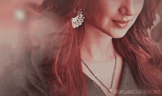 a close up of a woman 's face with ruksarcreations written below her