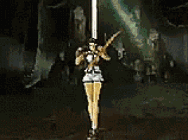 a statue of a woman holding a bow and arrow in a dark room .