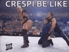 a group of wrestlers are kneeling down in a wrestling ring with the words `` creepi be like '' .