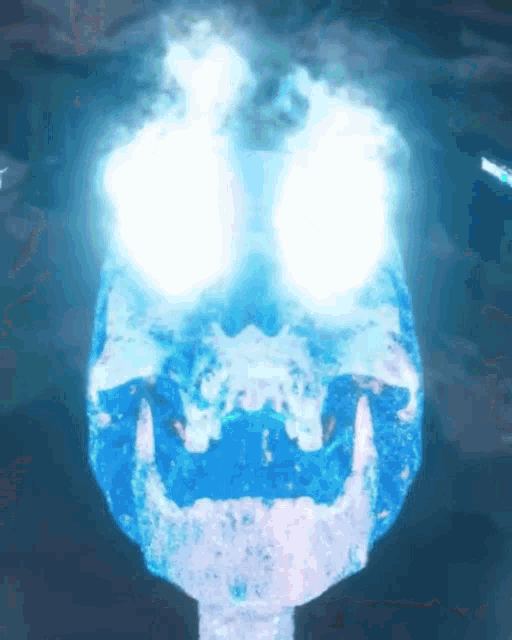 a blue skull with glowing eyes and a glowing mouth