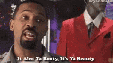 a man with a beard says it ain t ya booty it 's ya beauty