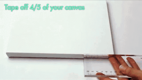 a blue tape measure is being used to measure a piece of white paper
