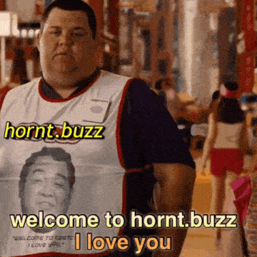 a man is wearing a shirt that says hornt.buzz