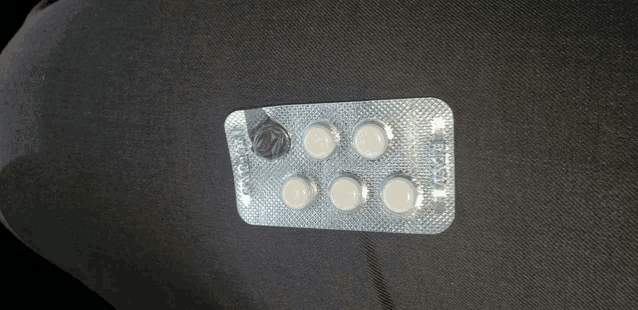 a blister pack of pills with a sticker that says ' 00 '