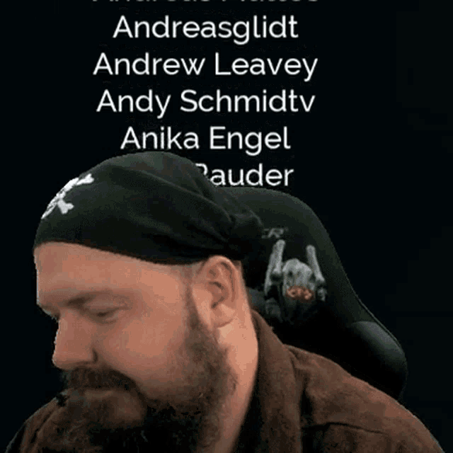a man wearing a black headband with the name andreasglidt on it