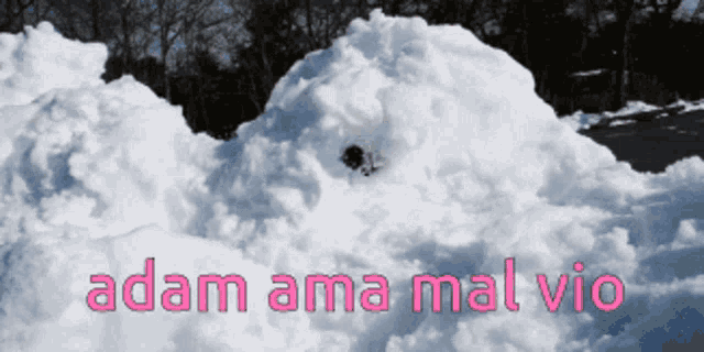 a large pile of snow with adam ama mal vio written on the bottom