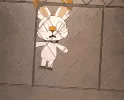 a cartoon bunny is behind a chain link fence .