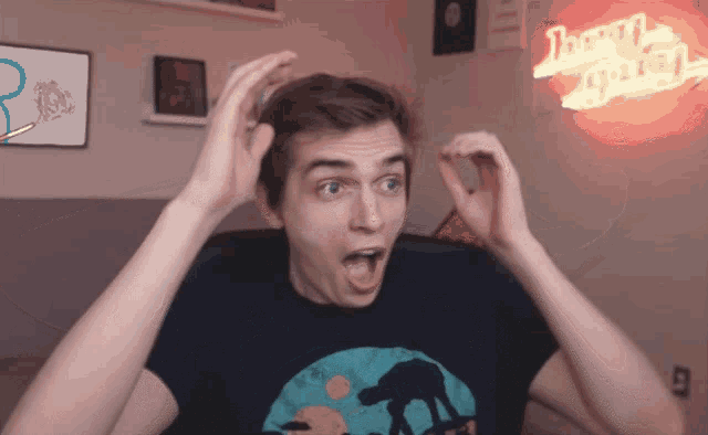 a man with a surprised look on his face is standing in front of a neon sign that says twenty eight