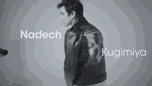 a black and white photo of a man wearing a leather jacket with the name nadech and kugimiya