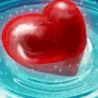 a red heart is floating in a swirl of water .