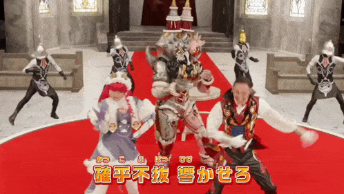 a group of people in costumes are dancing on a red carpet with chinese writing on the bottom