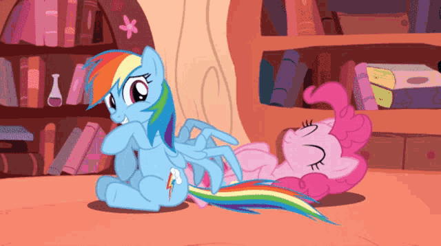 rainbow dash and pinkie pie from my little pony are sitting next to each other
