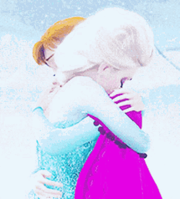 anna and elsa are hugging each other in the snow