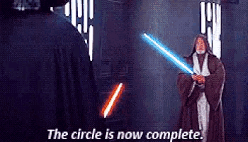a man in a robe is holding a light saber and says the circle is now complete