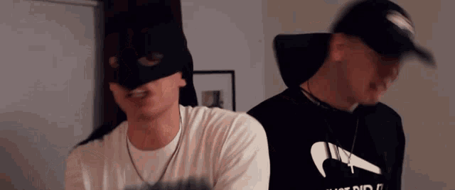 a man wearing a mask and a shirt that says just do it