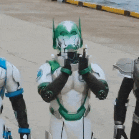 a person in a green and white robot costume